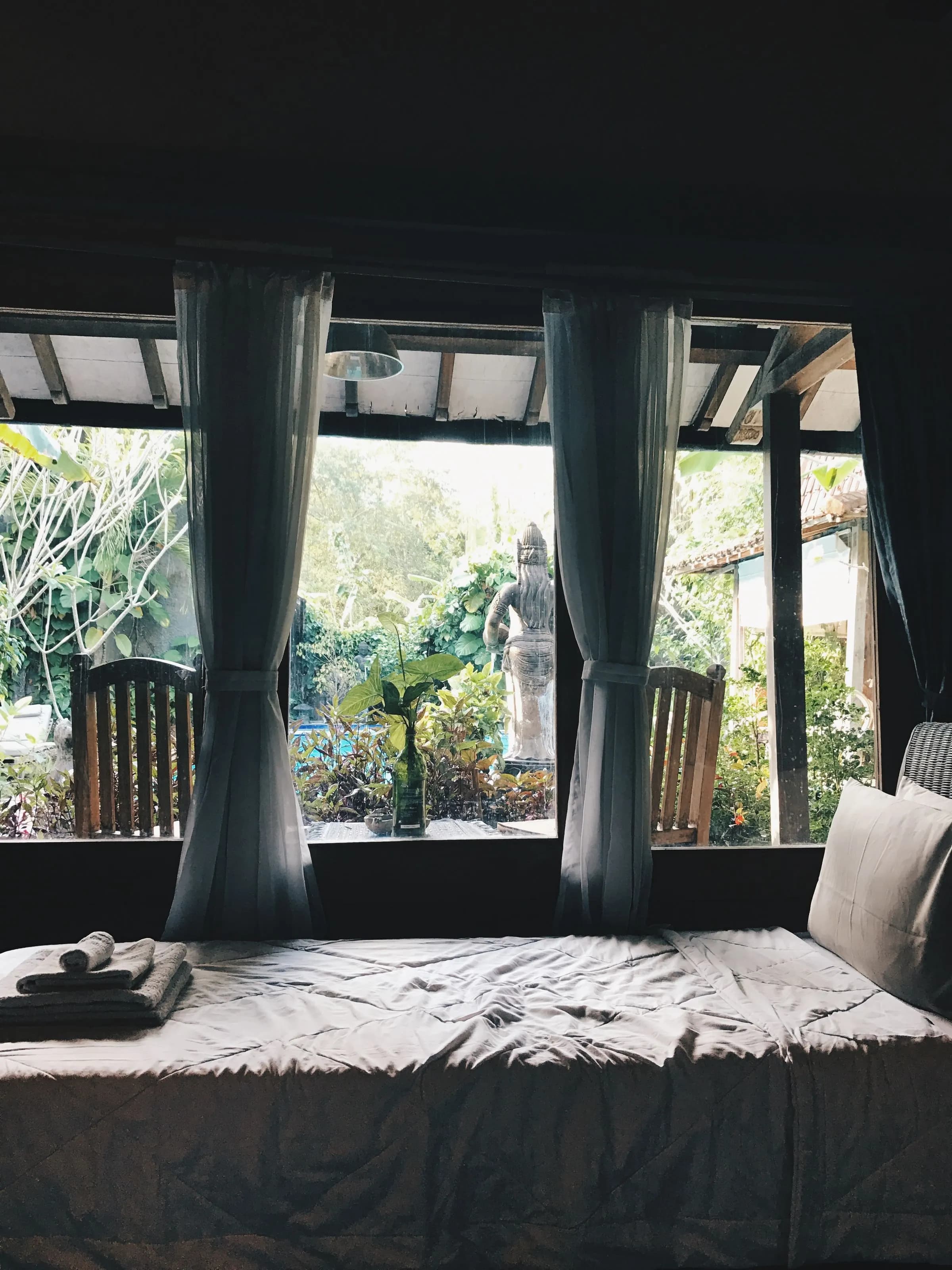 Suite bedroom overlooking a tropical garden