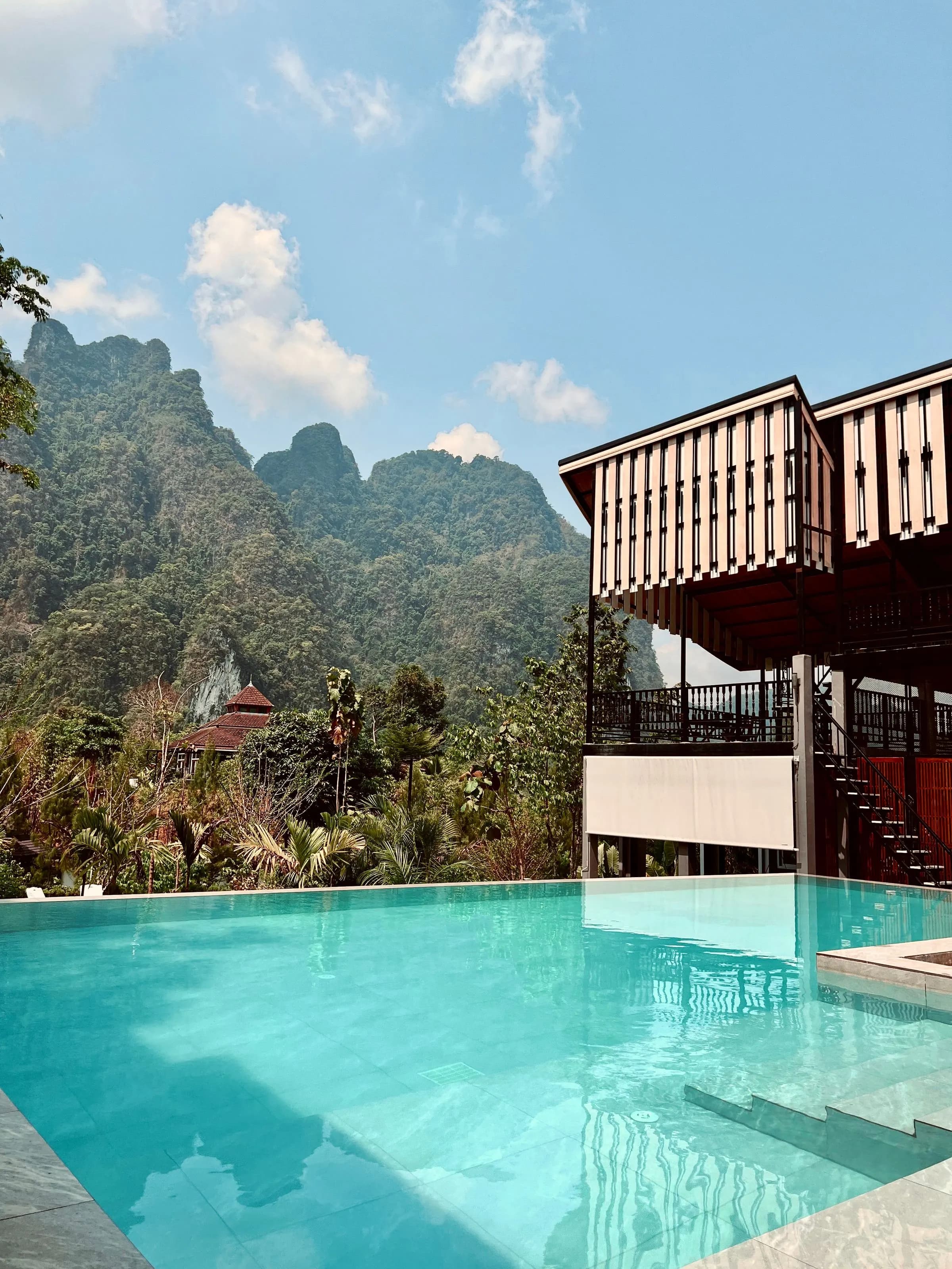 Resort pool with limestone mountains in the background